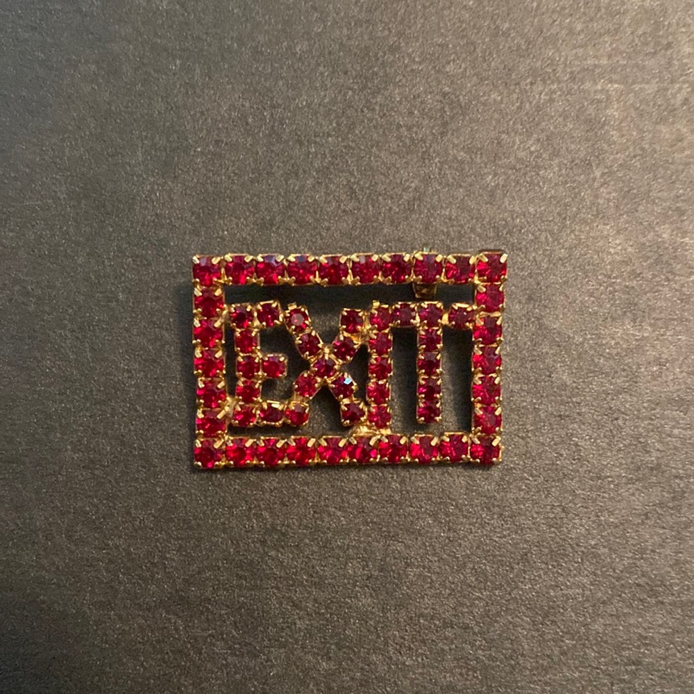 EXIT red rhinestone brooch